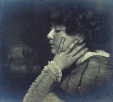 Woman resting her head on her left hand, head-and-shoulders profile portrait, c1900. Creator: Unknown