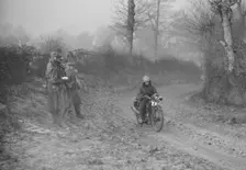 Woman riding a Royal Enfield motorcycle in the Gloucester Trial, c1930s. Artist: Bill Brunell
