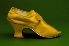Woman's yellow silk shoe with "louis heel", England, between c.1760 and c.1765. Creator: Unknown