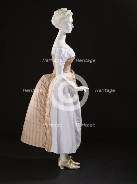 Woman's bustle, England, c.1885. Corset: c.1865-75, Chemise: c.1850-70, Shoes: 1875-1900. Creator: Unknown.