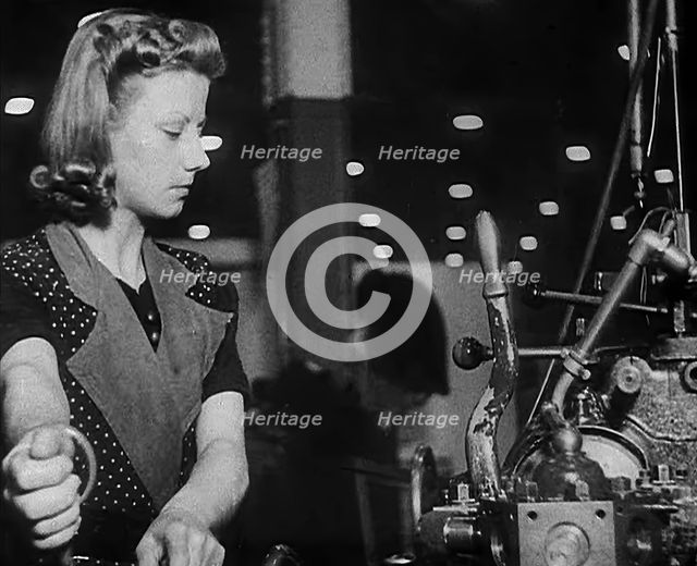 Woman Working in a Factory, 1940. Creator: British Pathe Ltd.