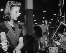 Woman Working in a Factory, 1940. Creator: British Pathe Ltd