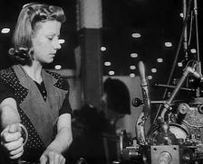 Woman Working in a Factory, 1940. Creator: British Pathe Ltd