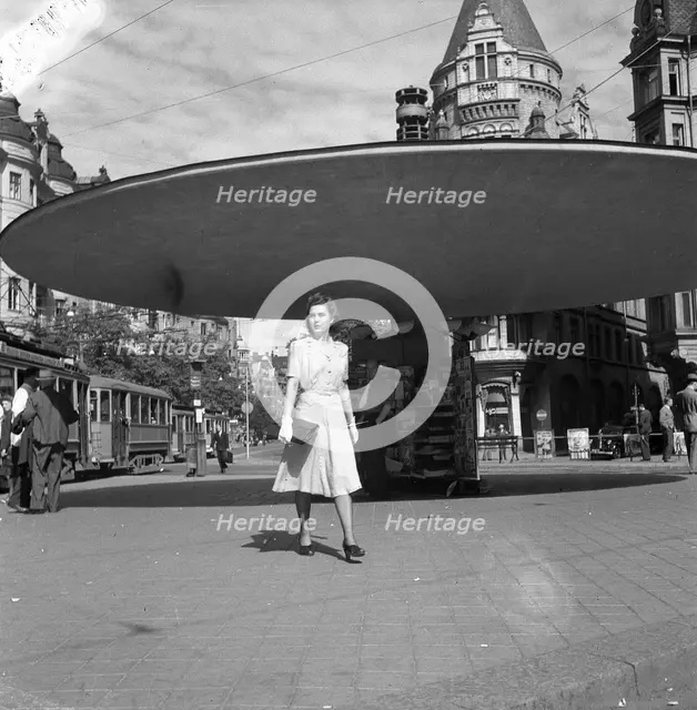Woman walking in the Stureplan square, Stockholm, Sweden, 24th July 1943. Creator: Karl Sandels.