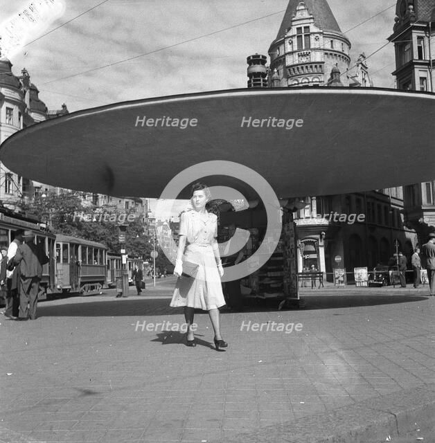 Woman walking in the Stureplan square, Stockholm, Sweden, 24th July 1943. Artist: Karl Sandels