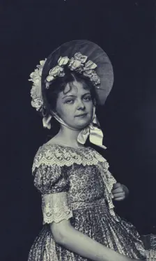 Woman wearing a bonnet, c1900. Creator: Emily G Mew