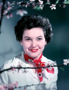 Woman wearing a red neck scarf, c1955. Creator: Arthur Charles Kirby Ware