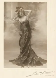 Woman wearing headdress with grapes, about 1890. Creator: Henri Mannes