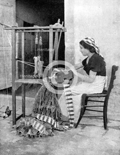 Woman weaving with straw on a hand loom, Fiesole, near Florence, Italy, 1936. Artist: Donald McLeish