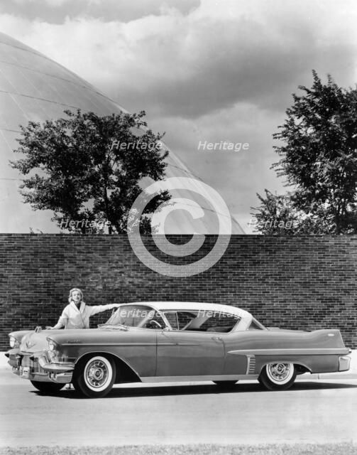 Woman with a 1957 Cadillac coupe de ville, (c1957?). Artist: Unknown
