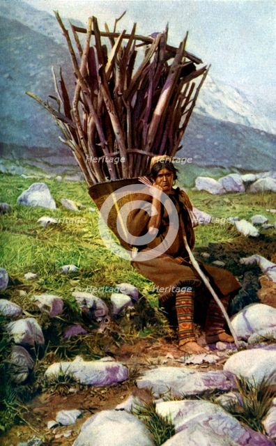 Woman with a load of wood, Afghanistan, c1924.Artist: Colonel JG Edwards