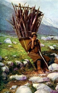 Woman with a load of wood, Afghanistan, c1924.Artist: Colonel JG Edwards