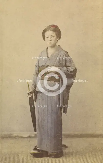 Woman with closed parasol, about 1868. Creator: Felice Beato.