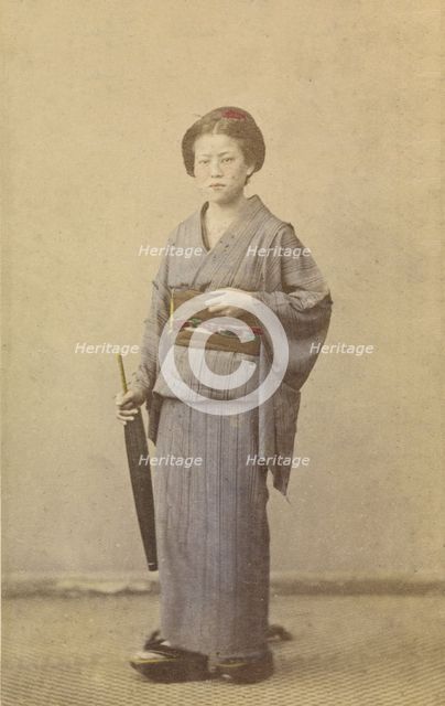 Woman with closed parasol, about 1868. Creator: Felice Beato.