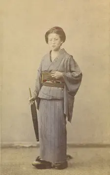 Woman with closed parasol, about 1868. Creator: Felice Beato