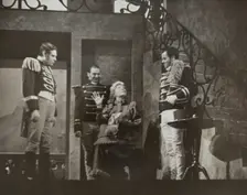 Woman talking to three men, 1938. Creator: Unknown