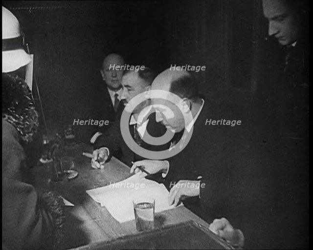 Woman Talking to Four Men Sitting at a Desk, 1933. Creator: British Pathe Ltd.