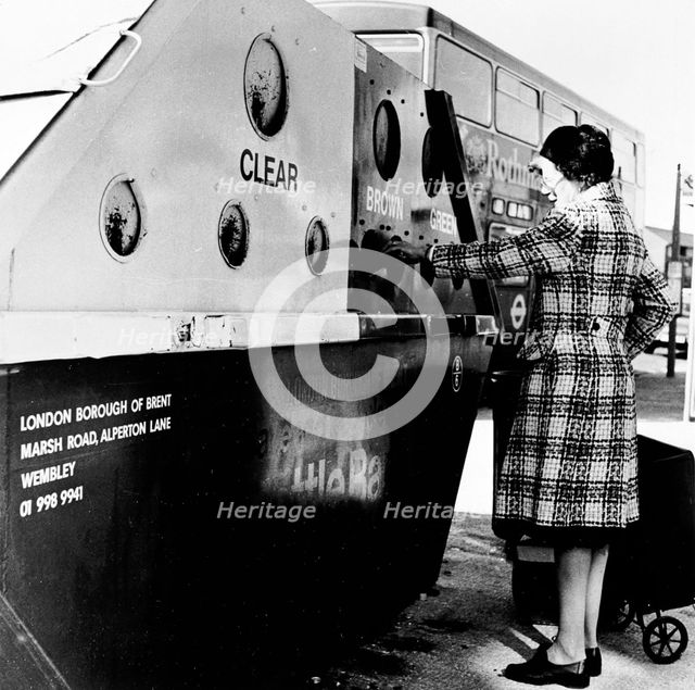 Woman using a bottle bank in Brent, London, c1950s. Creator: Henry Grant.