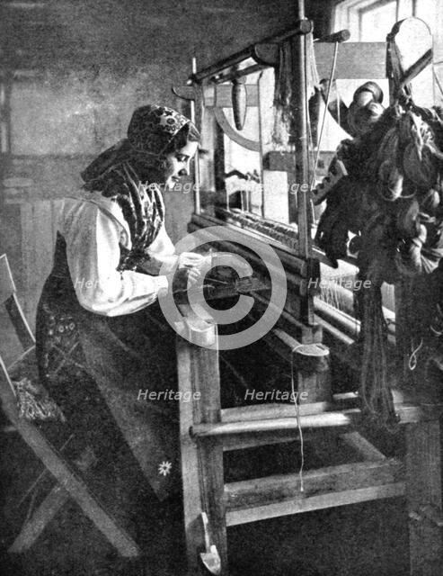 Woman using a loom, Sweden, 1936. Artist: Unknown