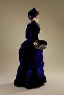 Woman's two-piece dress ensemble with matching hat, blue silk velvet., c.1880. Creator: Unknown