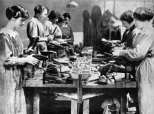 Women cobblers repairing footwear for the war effort, 1914-1918 (1936)