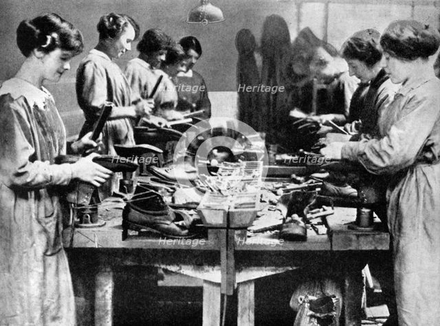 Women cobblers repairing footwear for the war effort, 1914-1918 (1936). Artist: Unknown