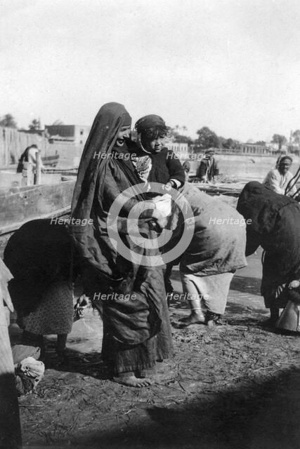 Women collecting water at on the Tigris River, Baghdad, Iraq, 1917-1919. Artist: Unknown