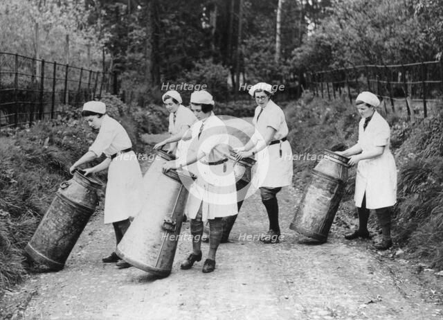 Women churning milk, c1940s(?). Artist: Unknown