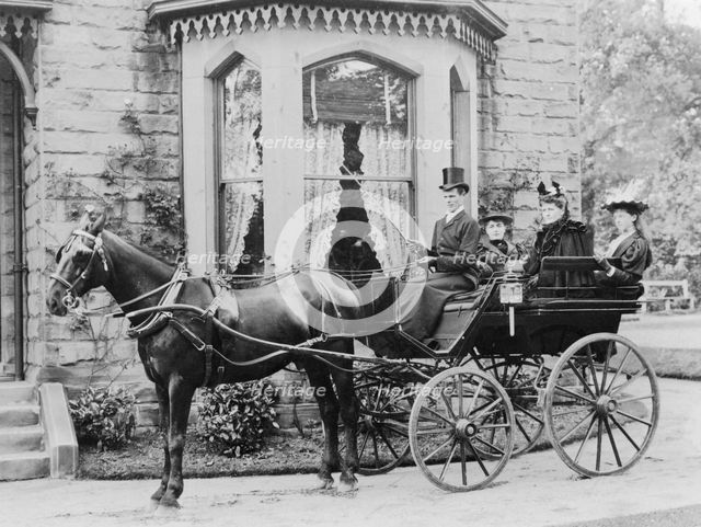 Women and a coachman in a pony and trap, late 19th century. Artist: Unknown