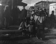 Women and children crossing a street, Chinatown, San Francisco, between 1896 and 1906. Creator: Arnold Genthe