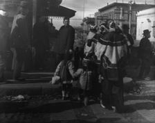 Women and children crossing a street, Chinatown, San Francisco, between 1896 and 1906. Creator: Arnold Genthe