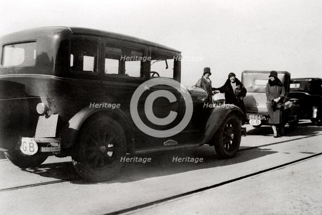Women and parked cars, 1930. Artist: Unknown