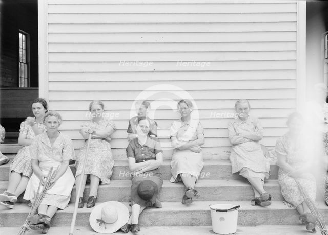 Women assembled at Wheeley's Church near Gordonton, North Carolina, to clean..., 1939. Creator: Dorothea Lange.