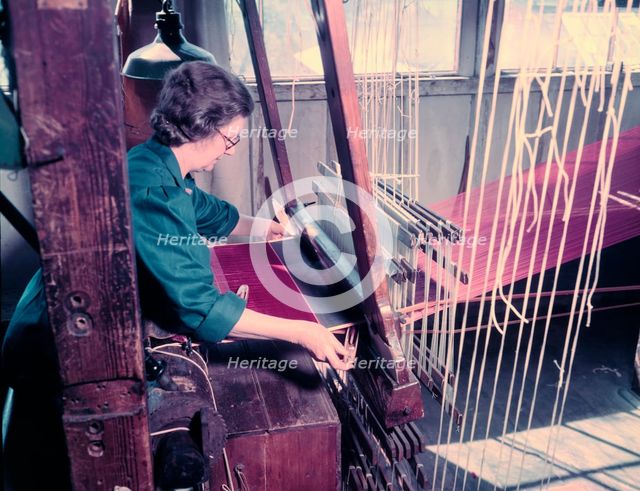Women at a loom weaving cloth for state robes to be worn at the coronation of Elizabeth II, 1953. Creator: Arthur Charles Kirby Ware.