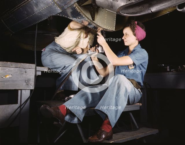 Women at work on bomber, Douglas Aircraft Company, Long Beach, Calif., 1942. Creator: Alfred T Palmer.