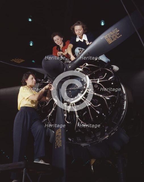 Women at work on C-47 Douglas cargo transport, Douglas Aircraft Company, Long Beach, Calif., 1942. Creator: Alfred T Palmer.