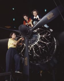Women at work on C-47 Douglas cargo transport, Douglas Aircraft Company, Long Beach, Calif., 1942. Creator: Alfred T Palmer