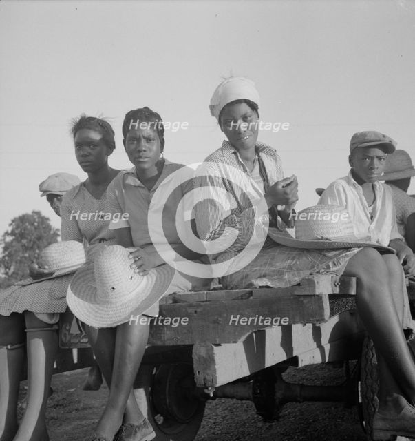 Women being transported from Memphis, Tennessee to an Arkansas plantation, 1937. Creator: Dorothea Lange.