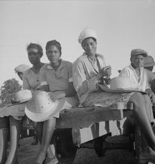 Women being transported from Memphis, Tennessee to an Arkansas plantation, 1937. Creator: Dorothea Lange