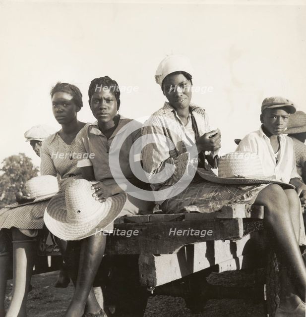 Women being transported from Memphis, Tennessee to an Arkansas plantation, July 1937. Creators: Farm Security Administration, Dorothea Lange.