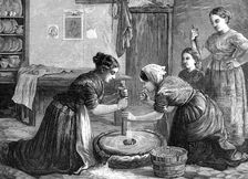 Women grinding corn in Ireland, 1874. Creator: Unknown