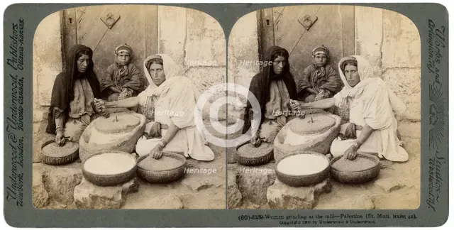 Women grinding at the mill, Palestine, 1900.Artist: Underwood & Underwood