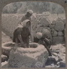 Women drawing water at the Fountain of the Magi, on the road to Bethlehem c1900