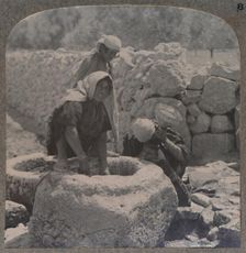 Women drawing water at the Fountain of the Magi, on the road to Bethlehem c1900