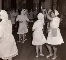 Women employees at Rowntrees Rock and Roll in their work clothes, York, Yorkshire, 1961