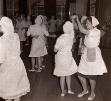 Women employees at Rowntrees Rock and Roll in their work clothes, York, Yorkshire, 1961
