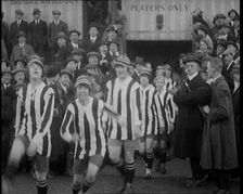Women Football Players Walking Out Onto the Pitch, 1920. Creator: British Pathe Ltd
