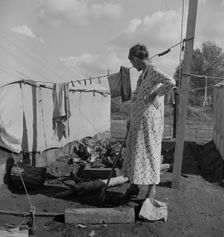 Women in auto camp for migrant citrus workers, Tulare County, California, 1938. Creator: Dorothea Lange