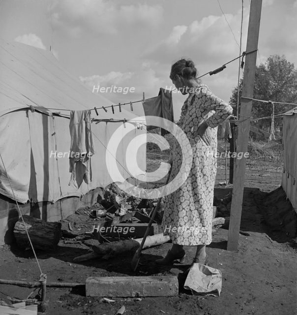 Women in auto camp for migrant citrus workers, Tulare County, California, 1938. Creator: Dorothea Lange.