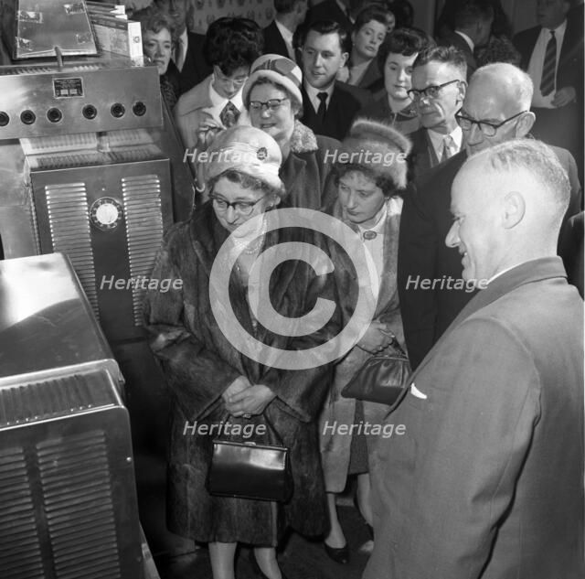 Women in fur coats at a food exhibition, Wilsic, near Doncaster, South Yorkshire, 1961.  Artist: Michael Walters